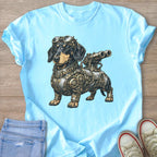 Steampunk dachshund with goggles and a telescope is featured on a light blue t-shirt.