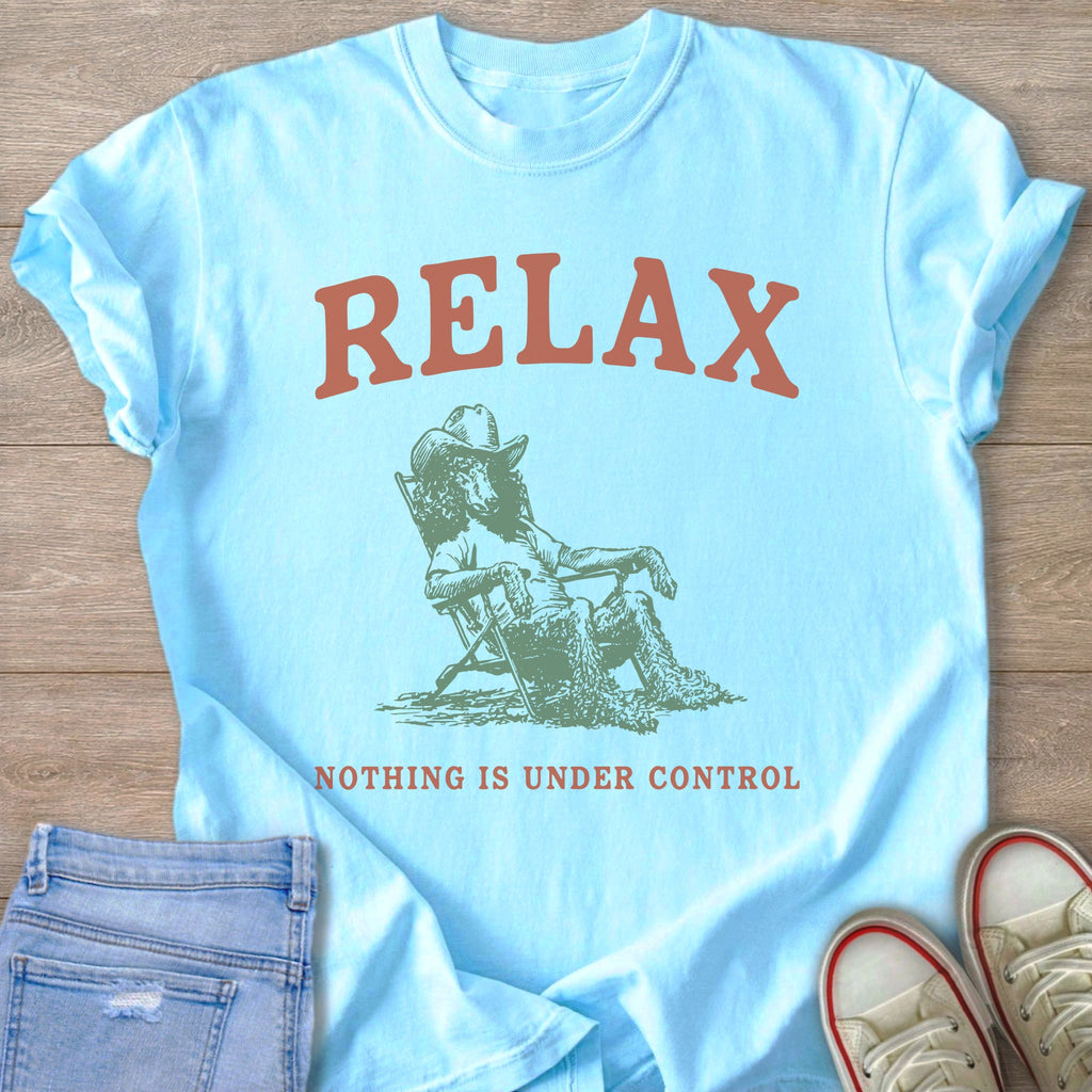 Light blue t-shirt with "RELAX" and an illustration of a dog wearing a cowboy hat.