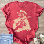T-shirt with distressed pug wearing a cowboy hat and playing guitar graphic.