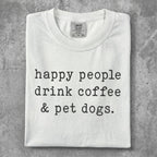 White t-shirt with "happy people drink coffee & pet dogs." text.