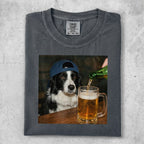 Border collie wearing a blue baseball cap, looking at a mug of beer being poured.