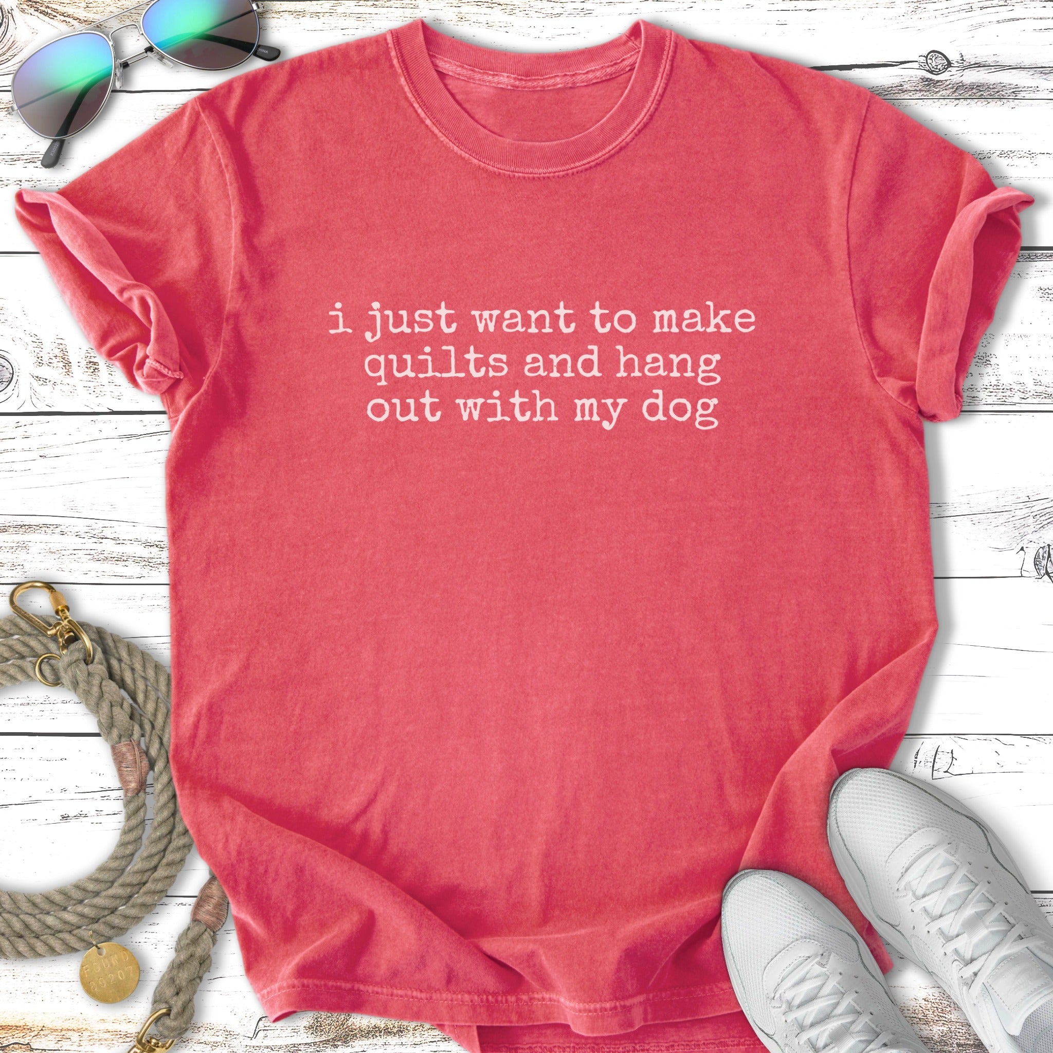 Coral t-shirt with white text: "i just want to make quilts and hang out with my dog"