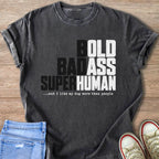 Dark grey t-shirt with "Bold Badass Superhuman" text and dog phrase.