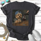 Yorkshire terrier wearing a baseball cap pours wine into a glass.