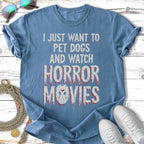 Blue t-shirt with "I just want to pet dogs and watch horror movies" in distressed red font.