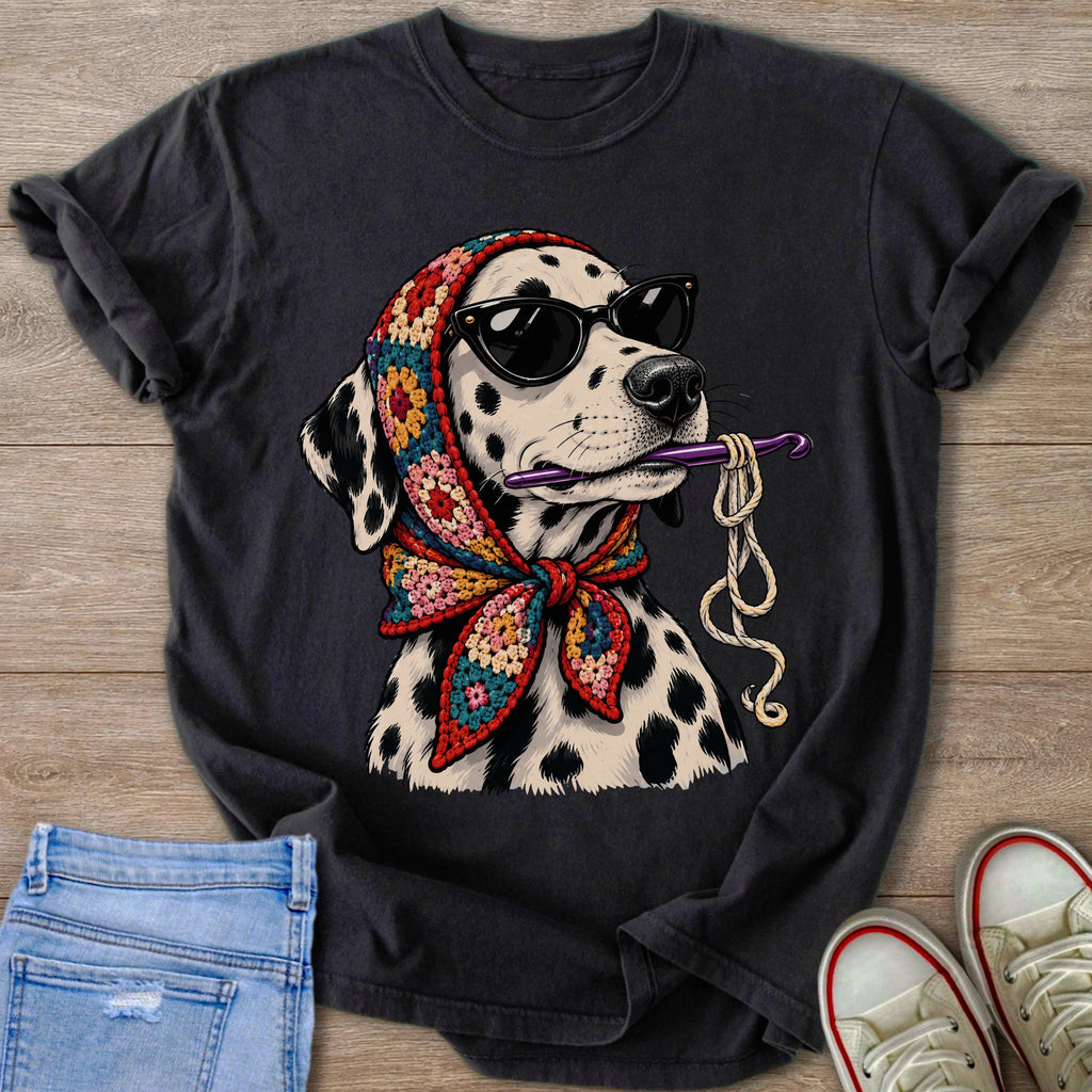 Dalmatian wearing sunglasses and crochet scarf, holding crochet hook and yarn.