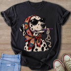 Dalmatian wearing sunglasses and crochet scarf, holding crochet hook and yarn.