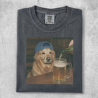 Golden retriever in blue hat drinks beer from mug on table.