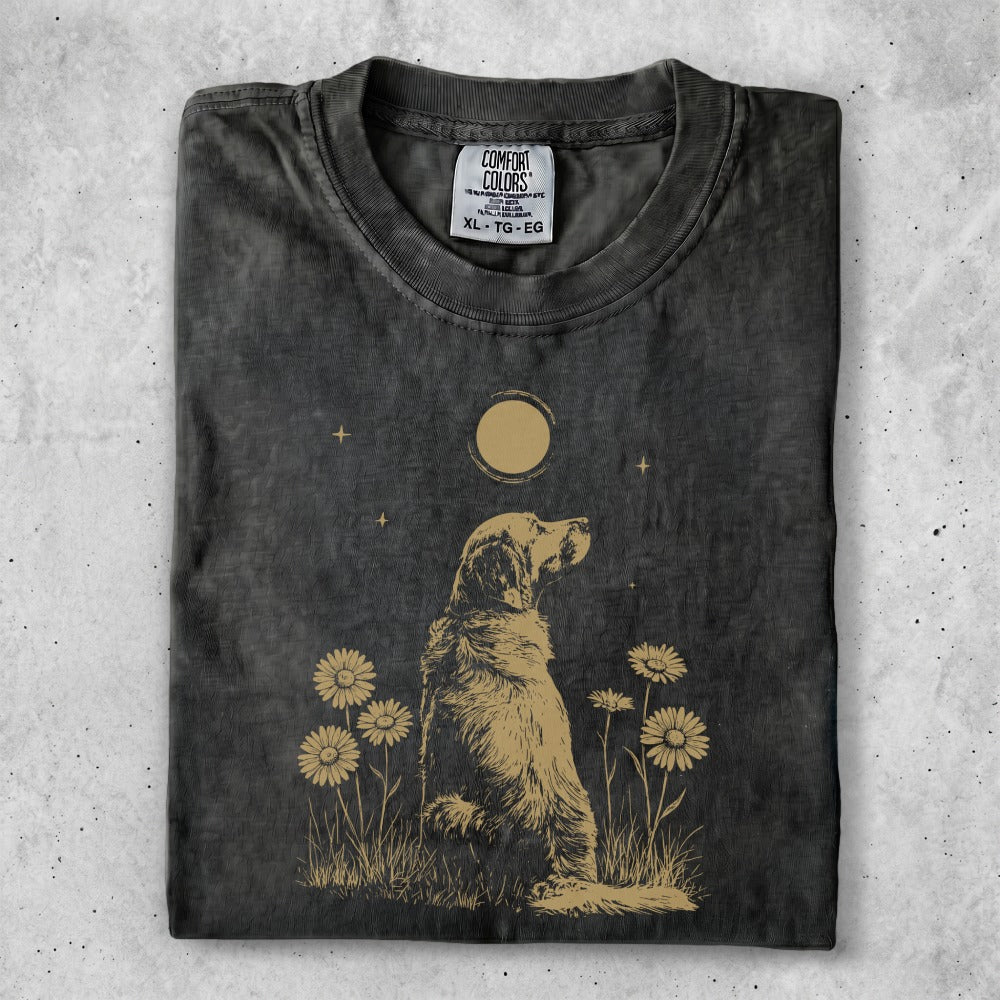 Graphic tee with a golden retriever sitting among daisies and a moon.