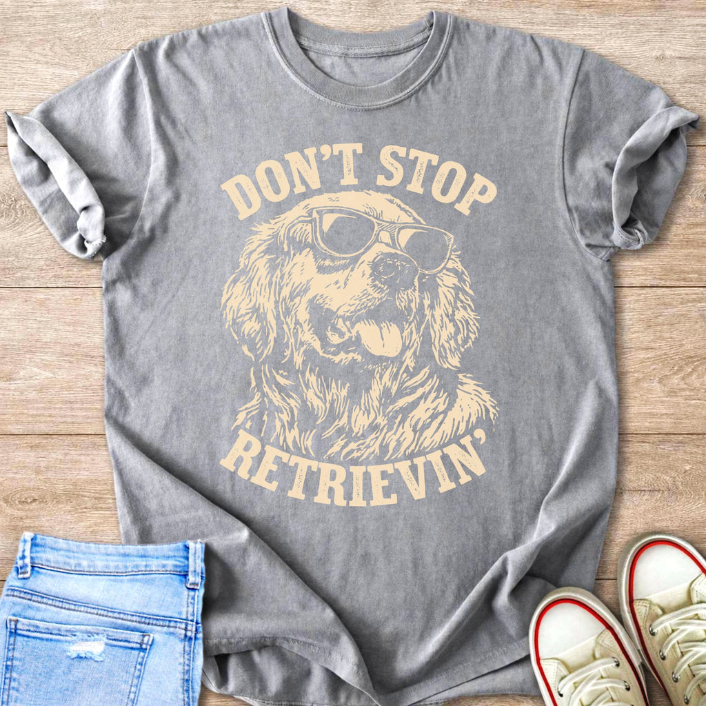 Graphic t-shirt with golden retriever wearing sunglasses and text "Don't Stop Retrieving".