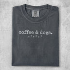 Charcoal t-shirt with "coffee & dogs." text and paw print design.