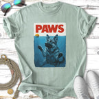German Shepherd dog swimming with "PAWS" text above water.