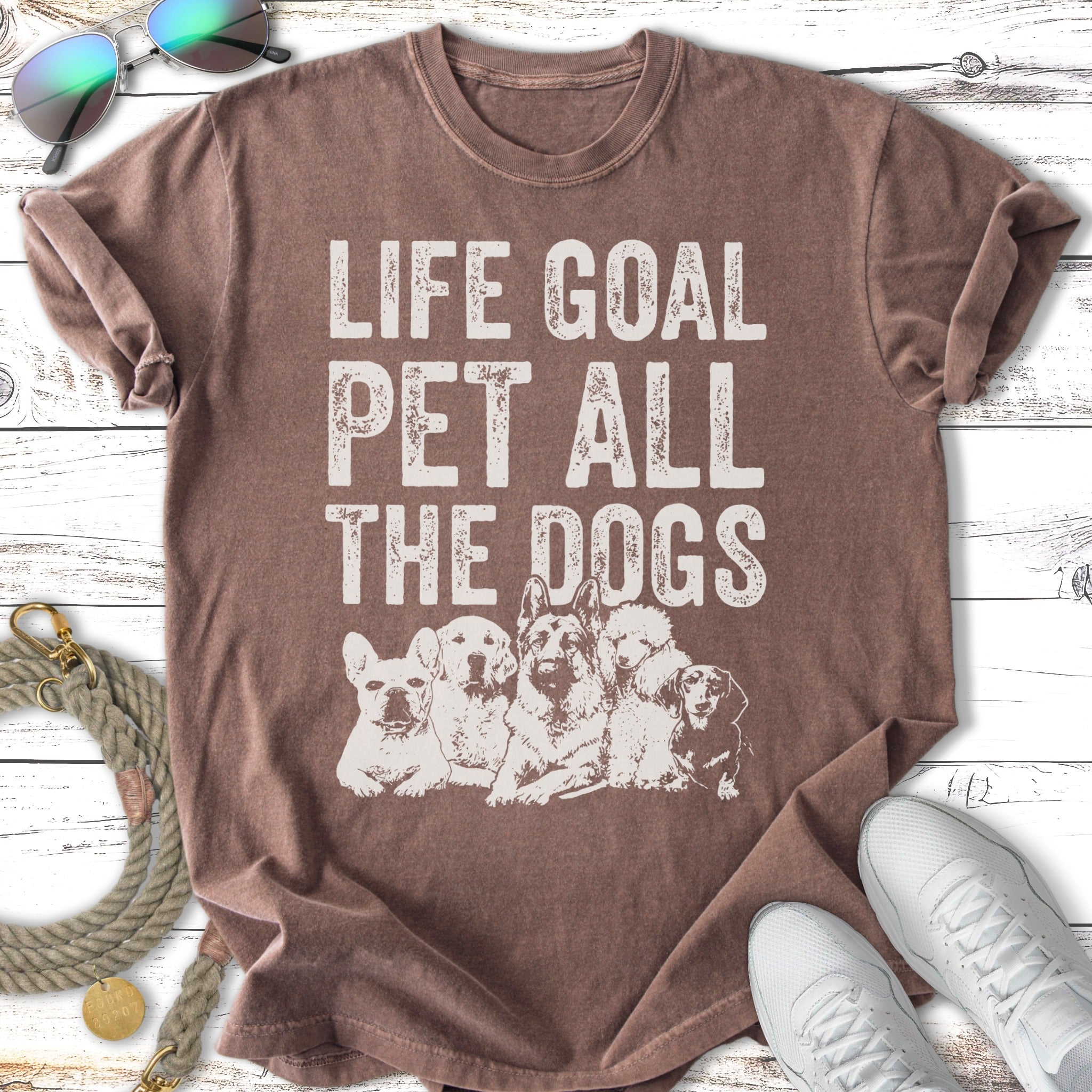 Graphic tee with dogs and text "Life Goal Pet All The Dogs."