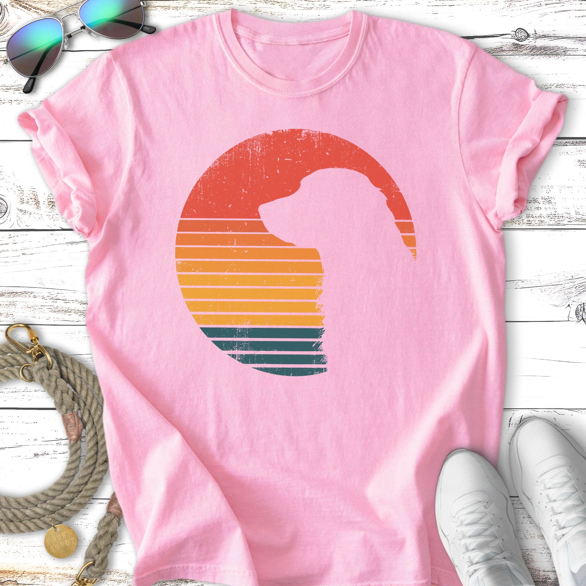 Pink t-shirt with a vintage sunset silhouette of a dog.