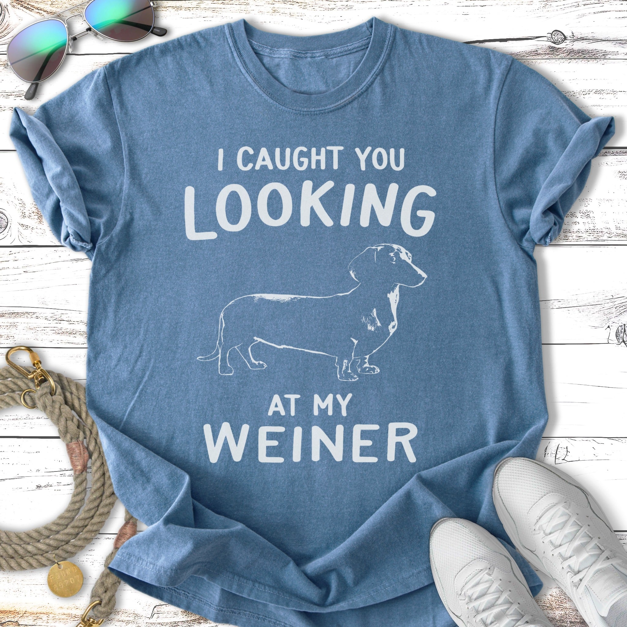 Blue t-shirt with "I CAUGHT YOU LOOKING AT MY WIENER" and dachshund graphic.