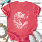 White outline of a dog holding a dandelion against a coral t-shirt.