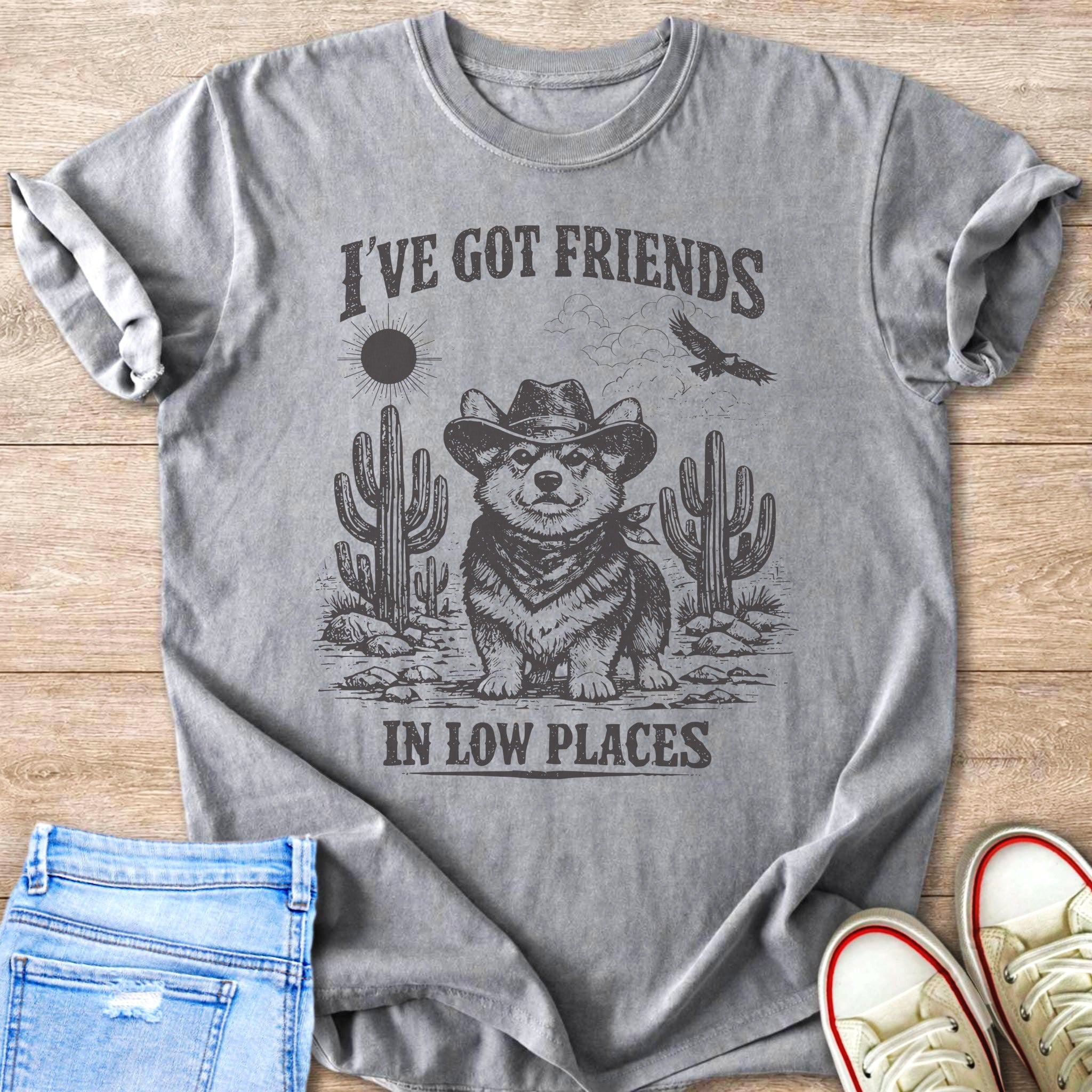 Grey t-shirt with a corgi wearing a cowboy hat and bandana in a desert scene.