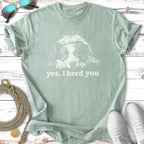 Light blue t-shirt with a white dog graphic and text that reads "yes, I herd you."