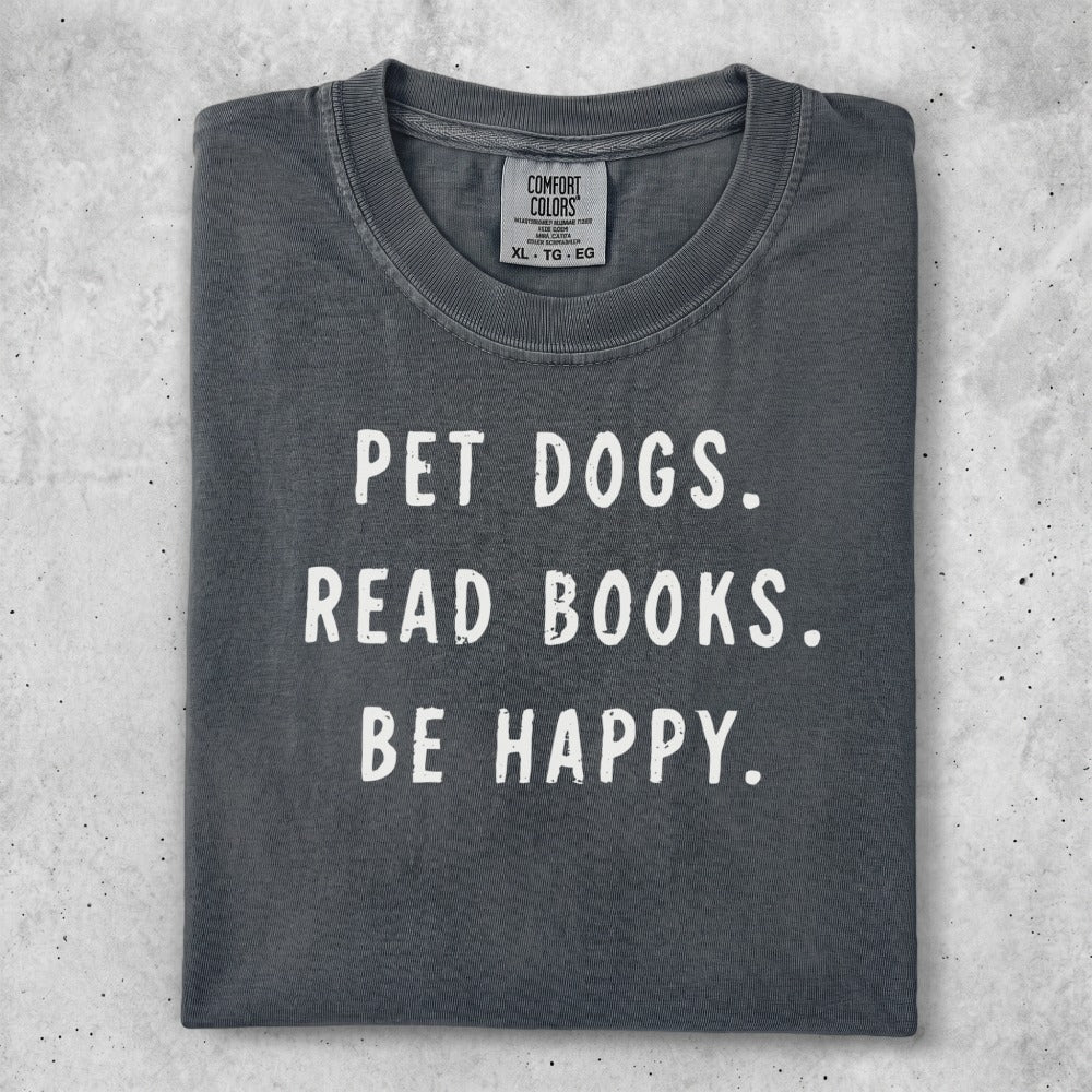 Comfort Colors t-shirt with "PET DOGS. READ BOOKS. BE HAPPY." text.