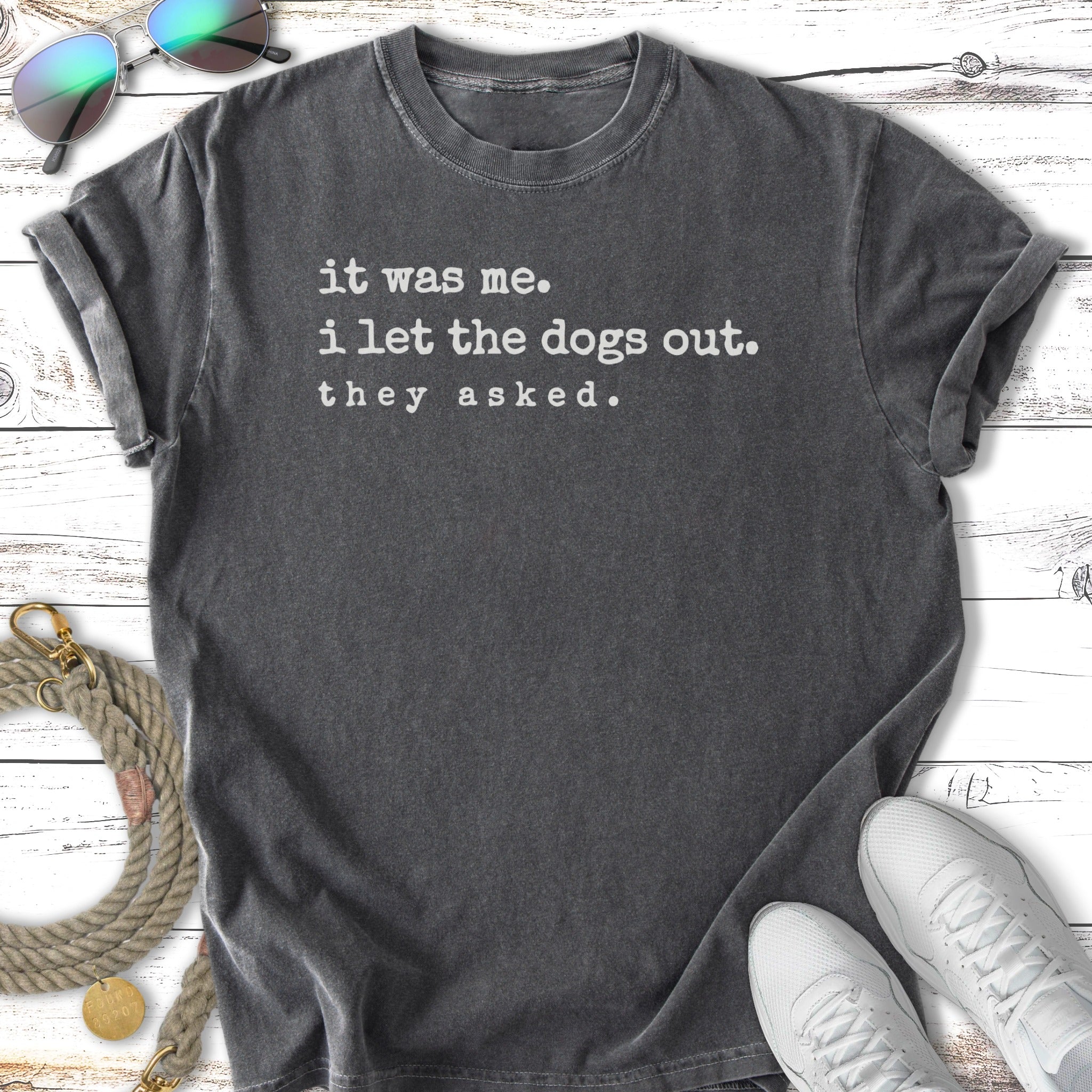 Dark grey t-shirt with text "it was me. i let the dogs out. they asked."
