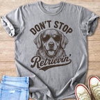 Grey t-shirt with "Don't Stop Retriein'" and sunglasses-wearing dog graphic.