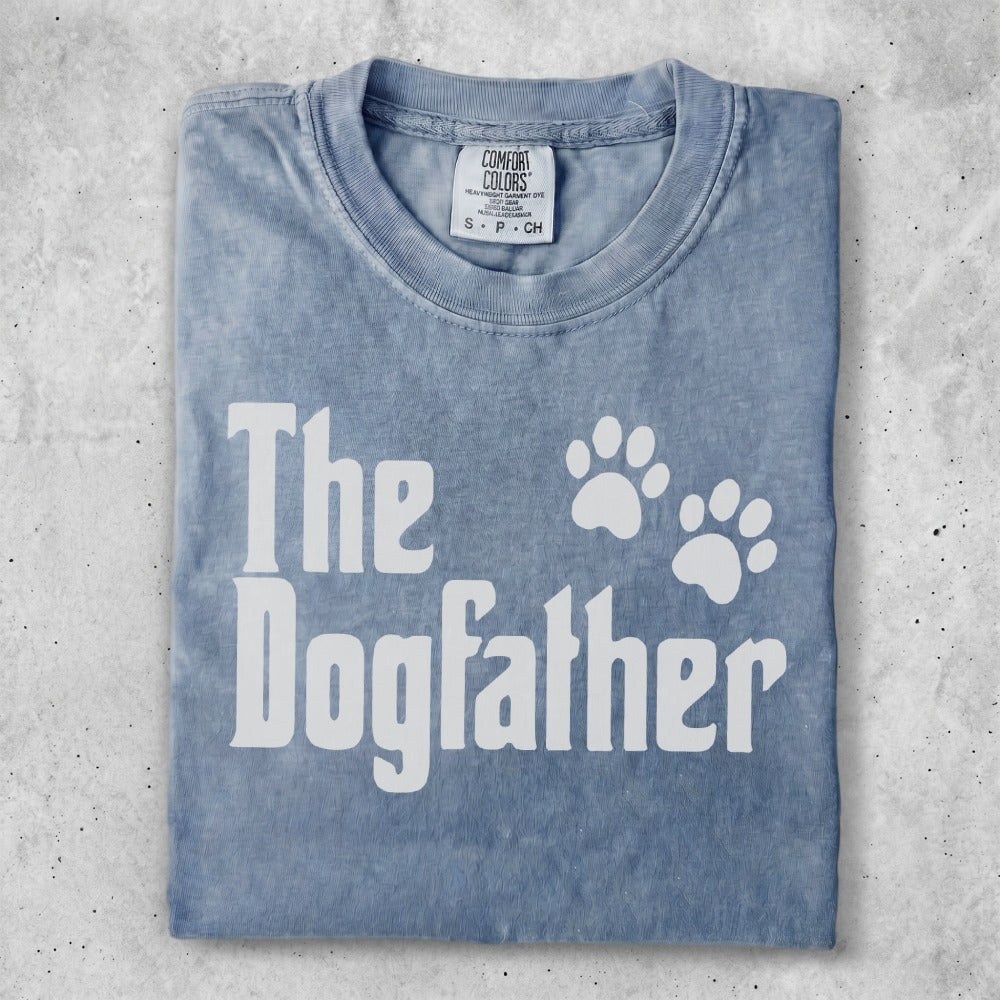 Distressed blue t-shirt with "The Dogfather" and paw prints.