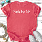 Coral t-shirt with "Bark for Me" text, sunglasses, leash, and sneakers.