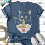 Black cat eating ramen from a bowl with chopsticks, on a t-shirt.