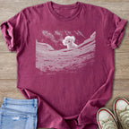 Berry Comfort colors 1717 T-shirt with a white Bichon Frise dog precious from silence of the lambs graphic, the dog is peeking from rock well. 