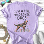 Purple t-shirt with floral dog graphic and "Just a girl who loves dogs" text.