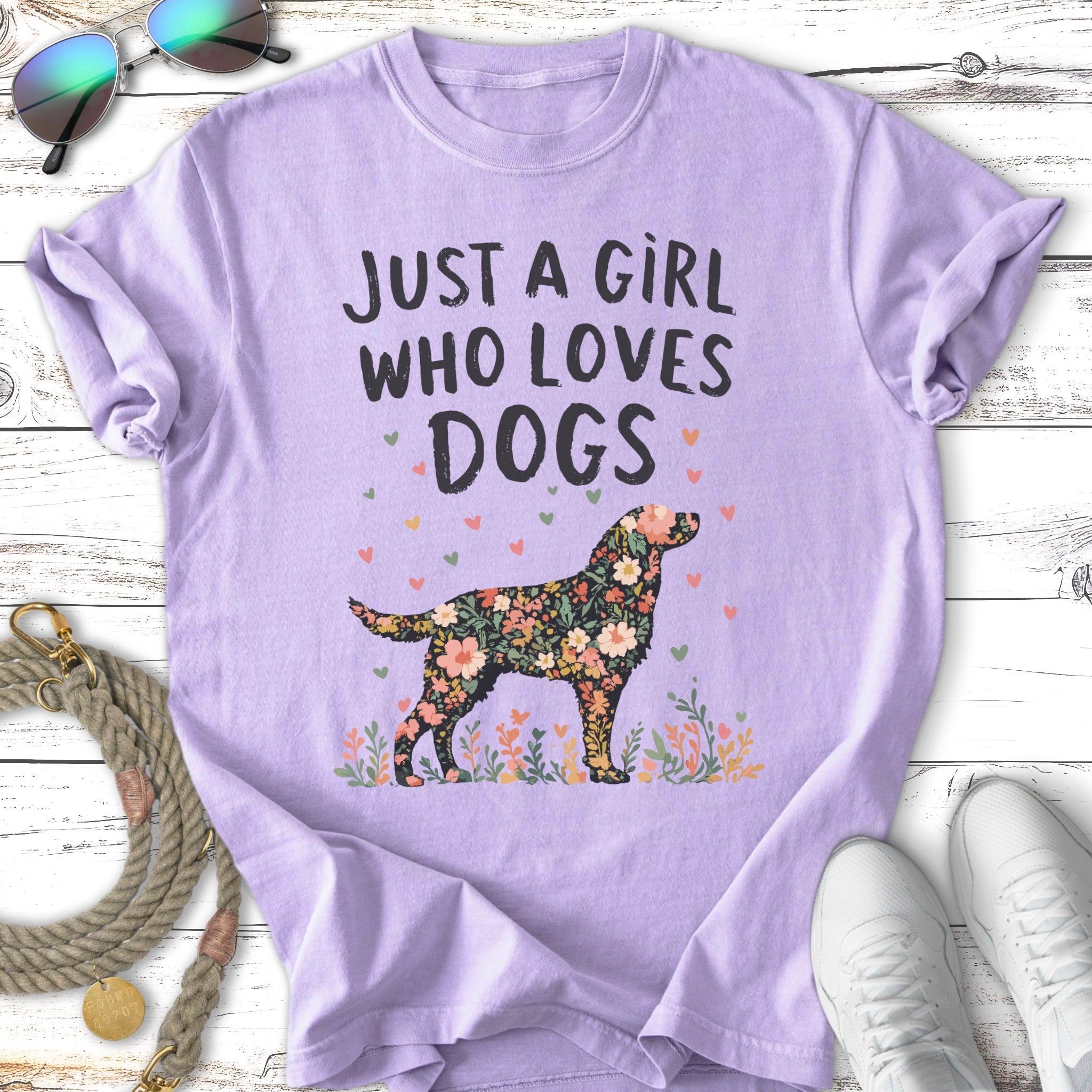 Purple t-shirt with floral dog graphic and "Just a girl who loves dogs" text.