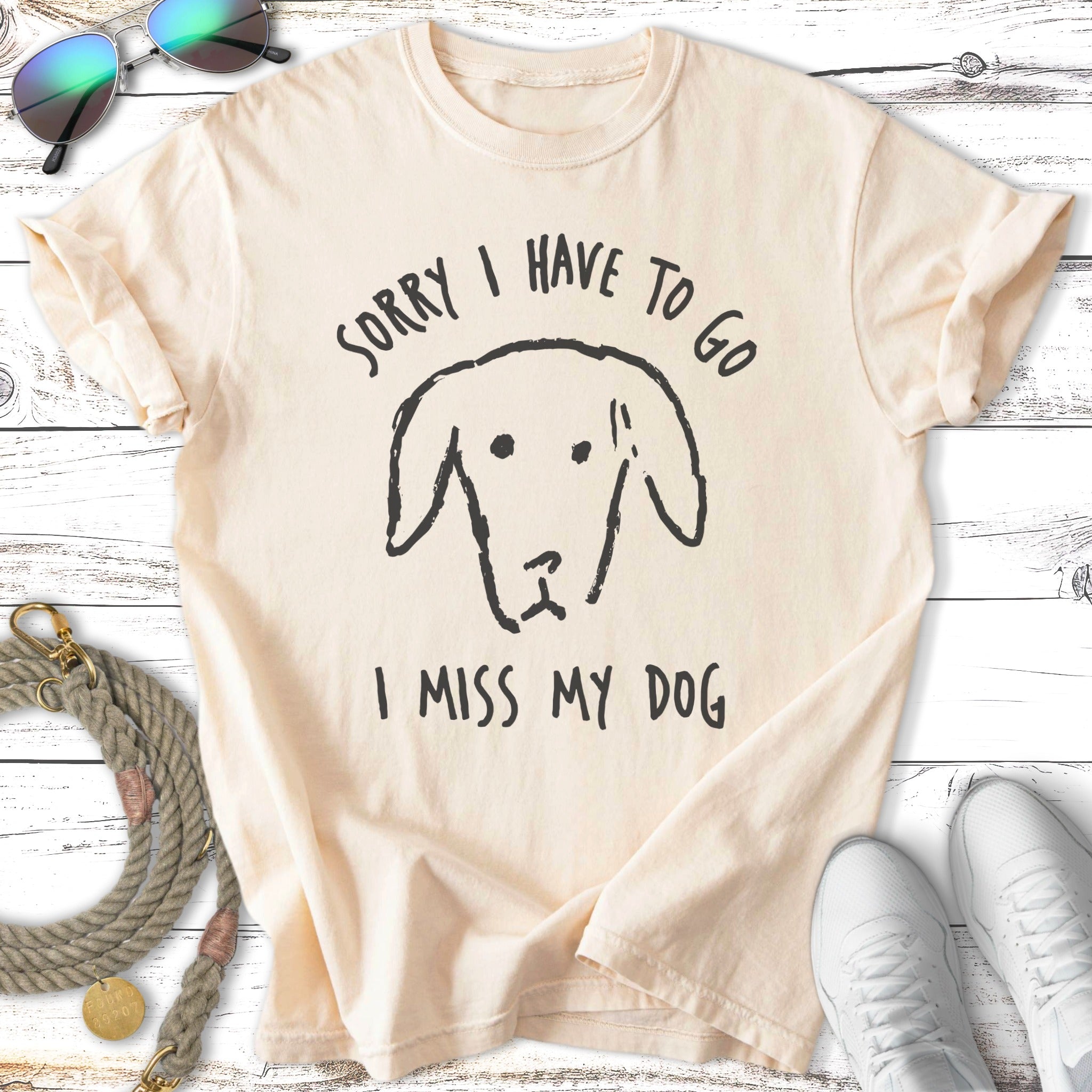 Cream t-shirt with black dog graphic and text "SORRY I HAVE TO GO I MISS MY DOG".