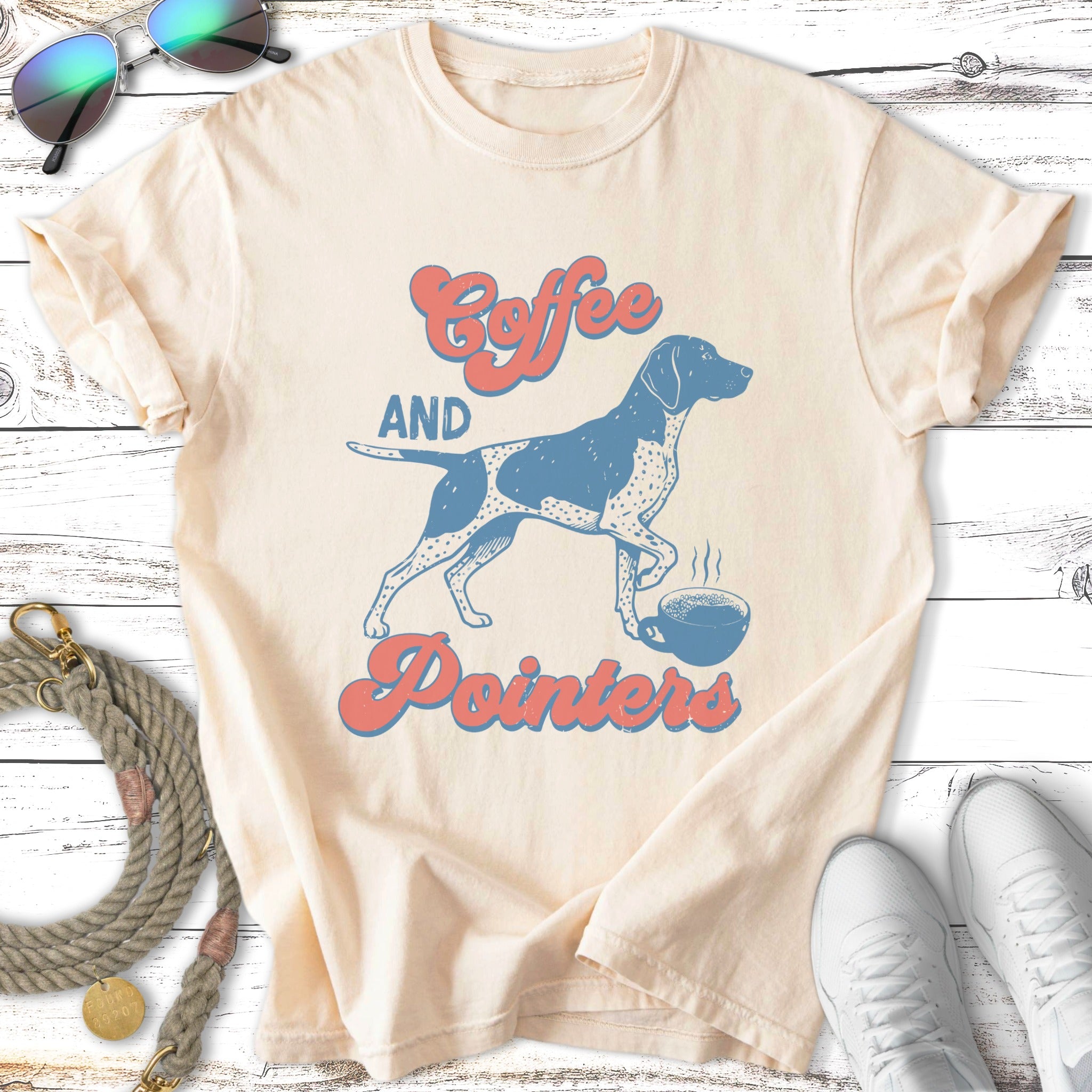 Cream t-shirt with "Coffee and Pointers" text and a dog next to a coffee cup.