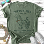 Green t-shirt with "Purrs & Pies Pizza Co." and a cat graphic.