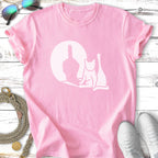 Pink t-shirt with white graphic of a cat, middle finger, and moon.