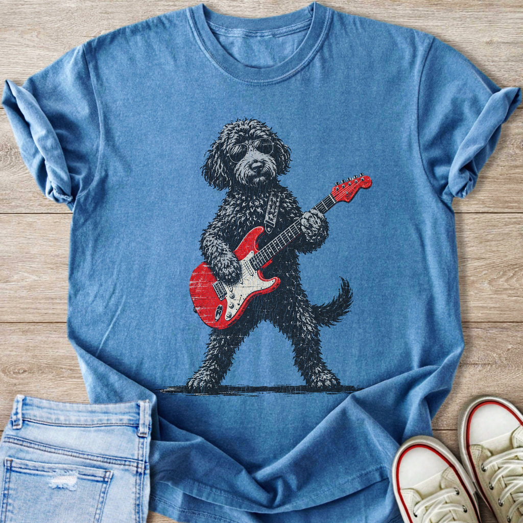 Blue t-shirt with a black poodle wearing sunglasses and playing a red electric guitar.