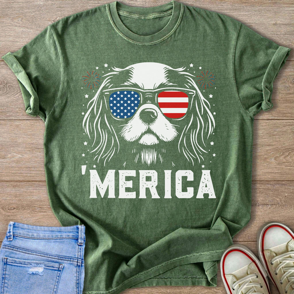 Dog wearing American flag sunglasses with 'MERICA text and fireworks.