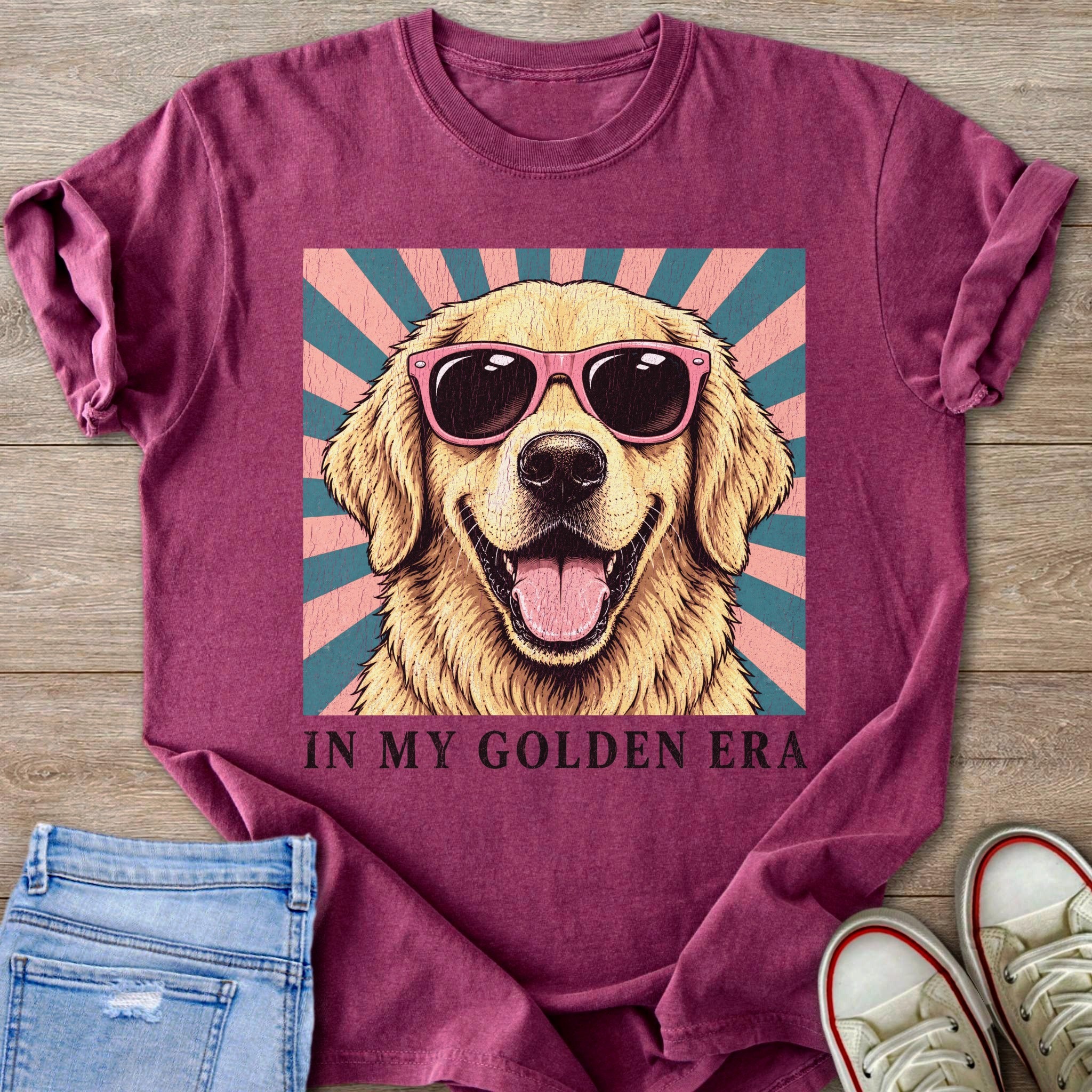 Golden retriever wearing pink sunglasses on a sunburst background, text reads "IN MY GOLDEN ERA."