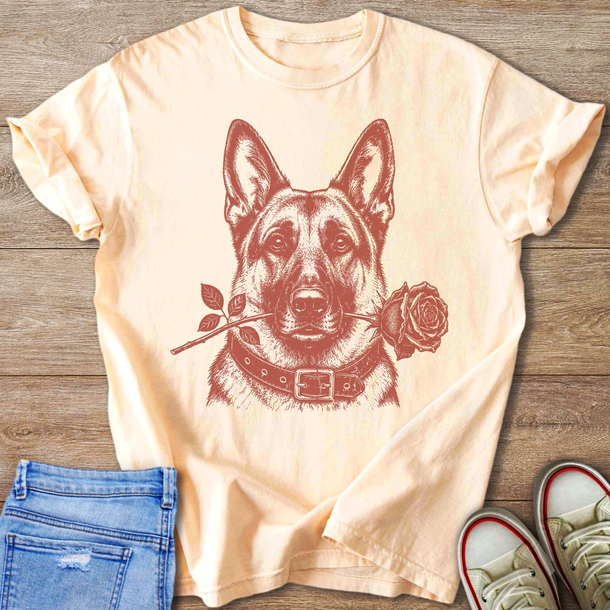 Peach t-shirt with a sketched German Shepherd holding a rose in its mouth.