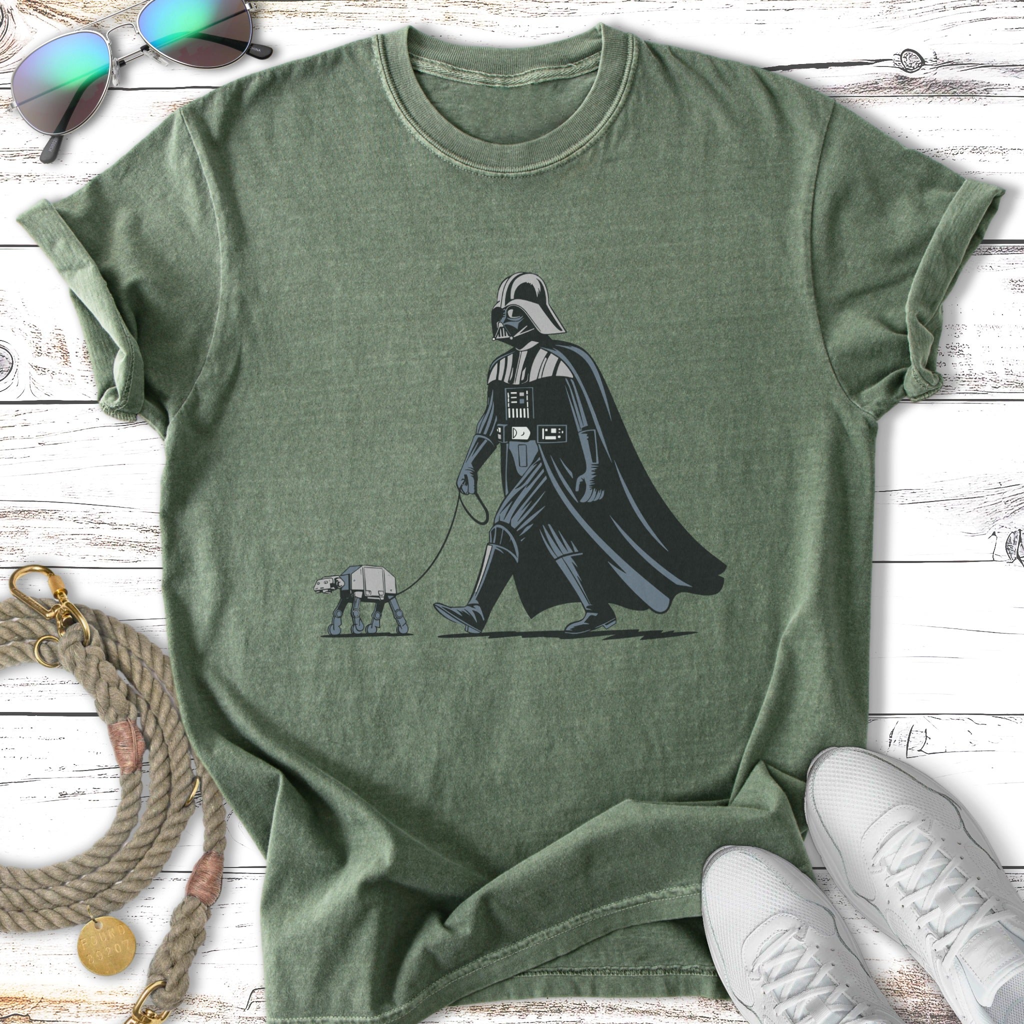 Darth Vader walking an AT-AT dog on a leash.