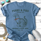 Purrs & Pies Pizza Co. t-shirt with a cat and "Whisker Licken' Good" text.