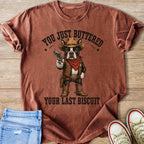 Boston terrier in cowboy attire holding a gun with text "You just buttered your last biscuit".