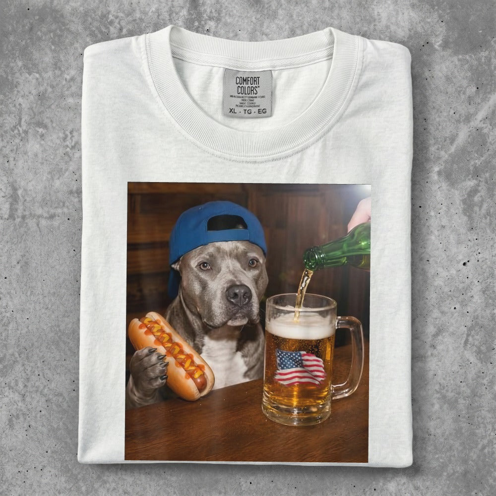 Dog in blue cap with hot dog, beer mug with American flag.