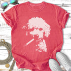 White poodle silhouette smoking a cigarette on a coral t-shirt.
