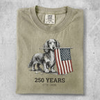 Dachshund holding American flag, "250 Years 1776-2026" text.