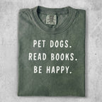 Green t-shirt with text "PET DOGS. READ BOOKS. BE HAPPY."
