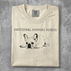 French bulldog graphic with "Emotional Support Potato" text on a cream t-shirt.