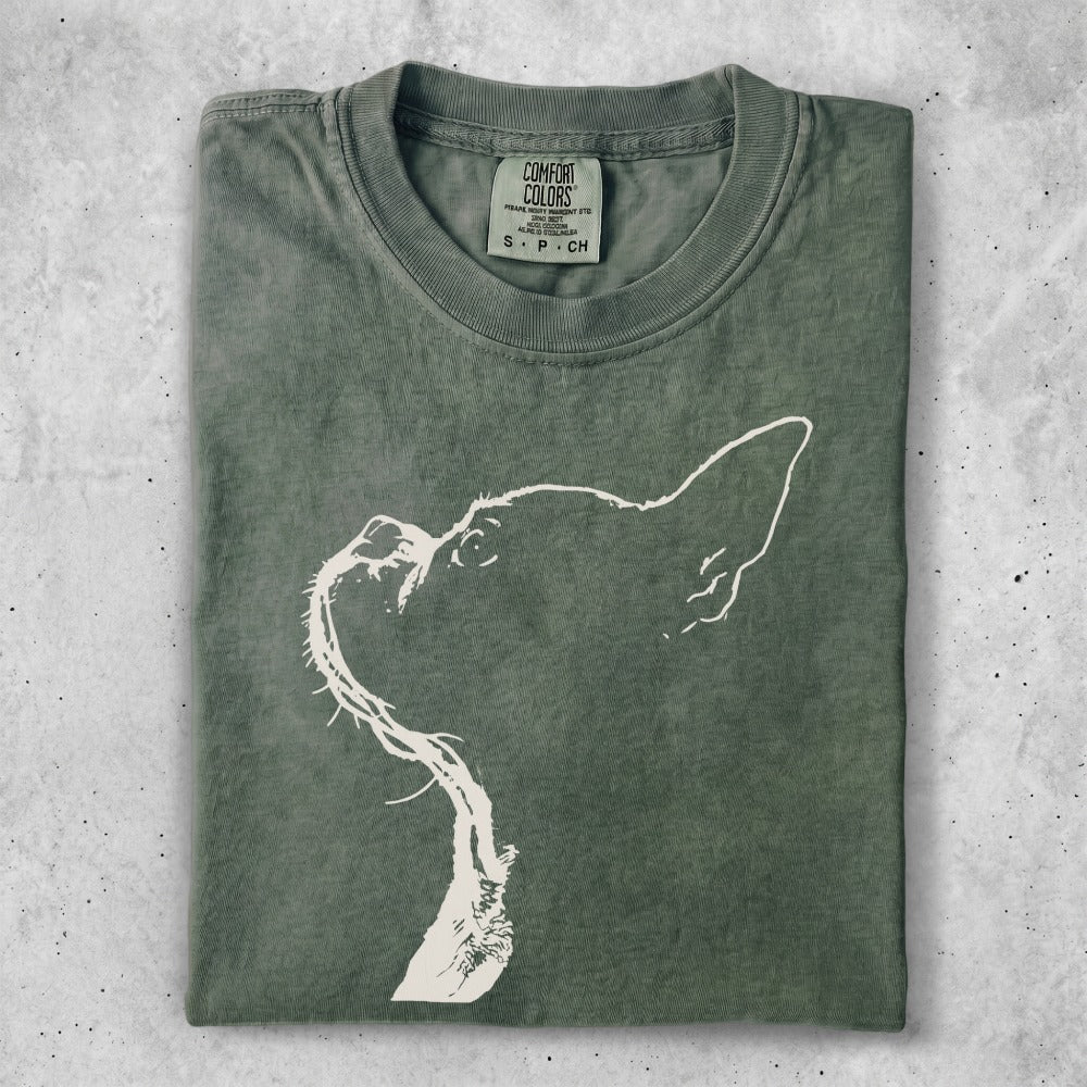 Green Comfort Colors t-shirt with a white outline of a dog's head.