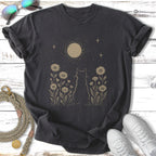Dark t-shirt with celestial cat and floral design.