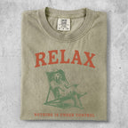 T-shirt with "RELAX" and a dog in a chair, "Nothing is Under Control".